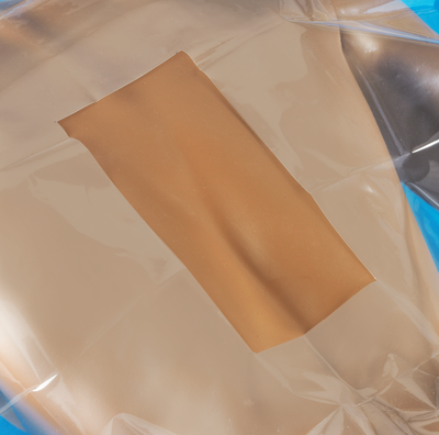 Sterile Blue Polylined Tissue Drape with 4" Round Fenestration and Adhesive Strip - 18" x 24"